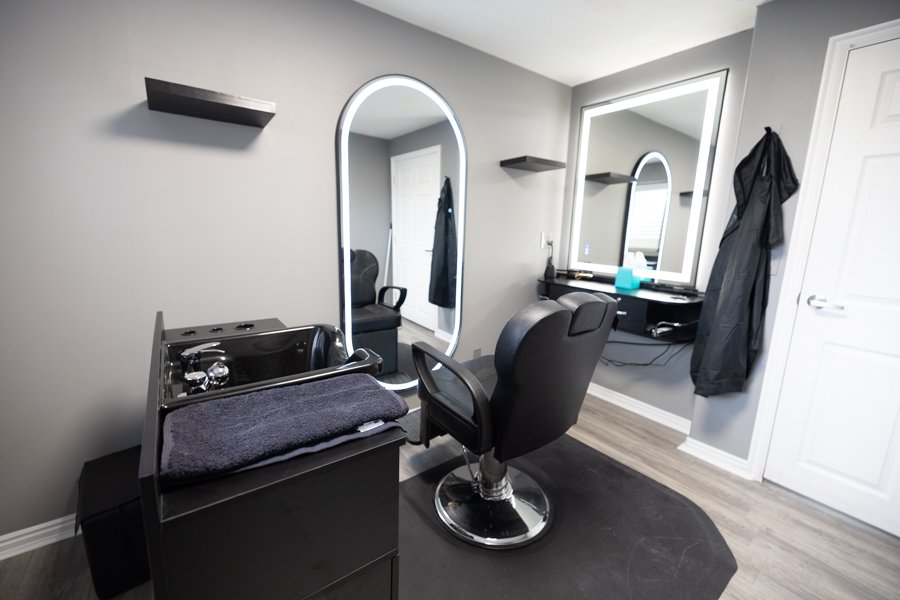 The salon studio at CGW Studios with a stylist chair and wash station.