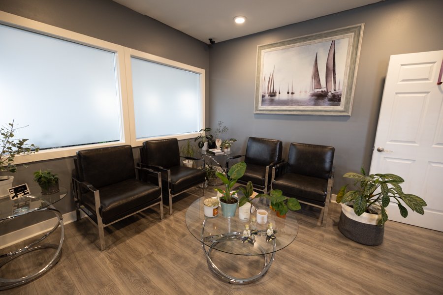 The welcoming waiting area at CGW Studios with comfortable seating and natural light.