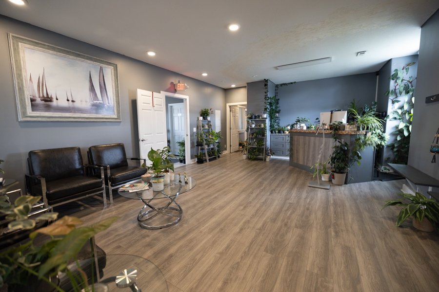 The lobby at CGW Studios with comfortable waiting-area seating, natural light, and 450 plus living plants.