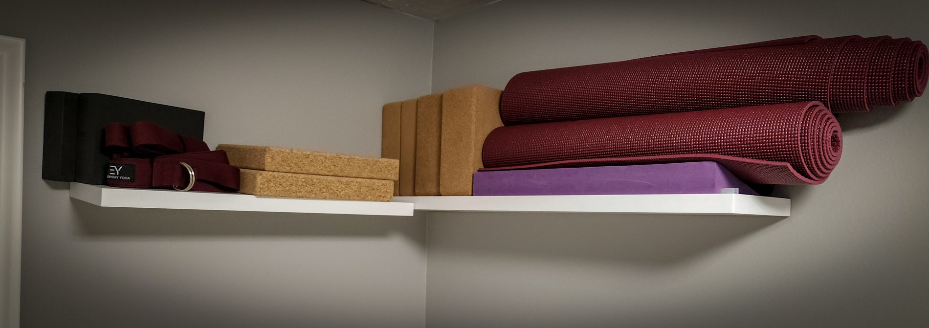 An open, table-free studio at CGW Studios with mats, blocks, and straps for floor-based movement work.