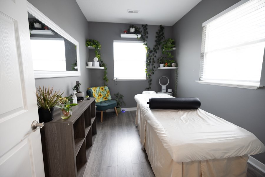 Studio 1 at CGW Studios showing the treatment table and warm natural light.