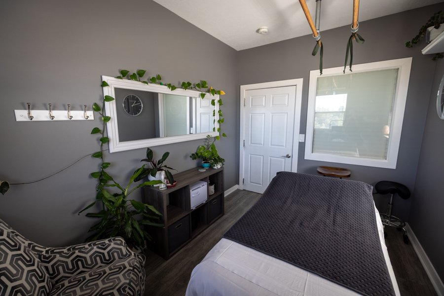 Studio 2 second angle showing the treatment table and warm lighting.